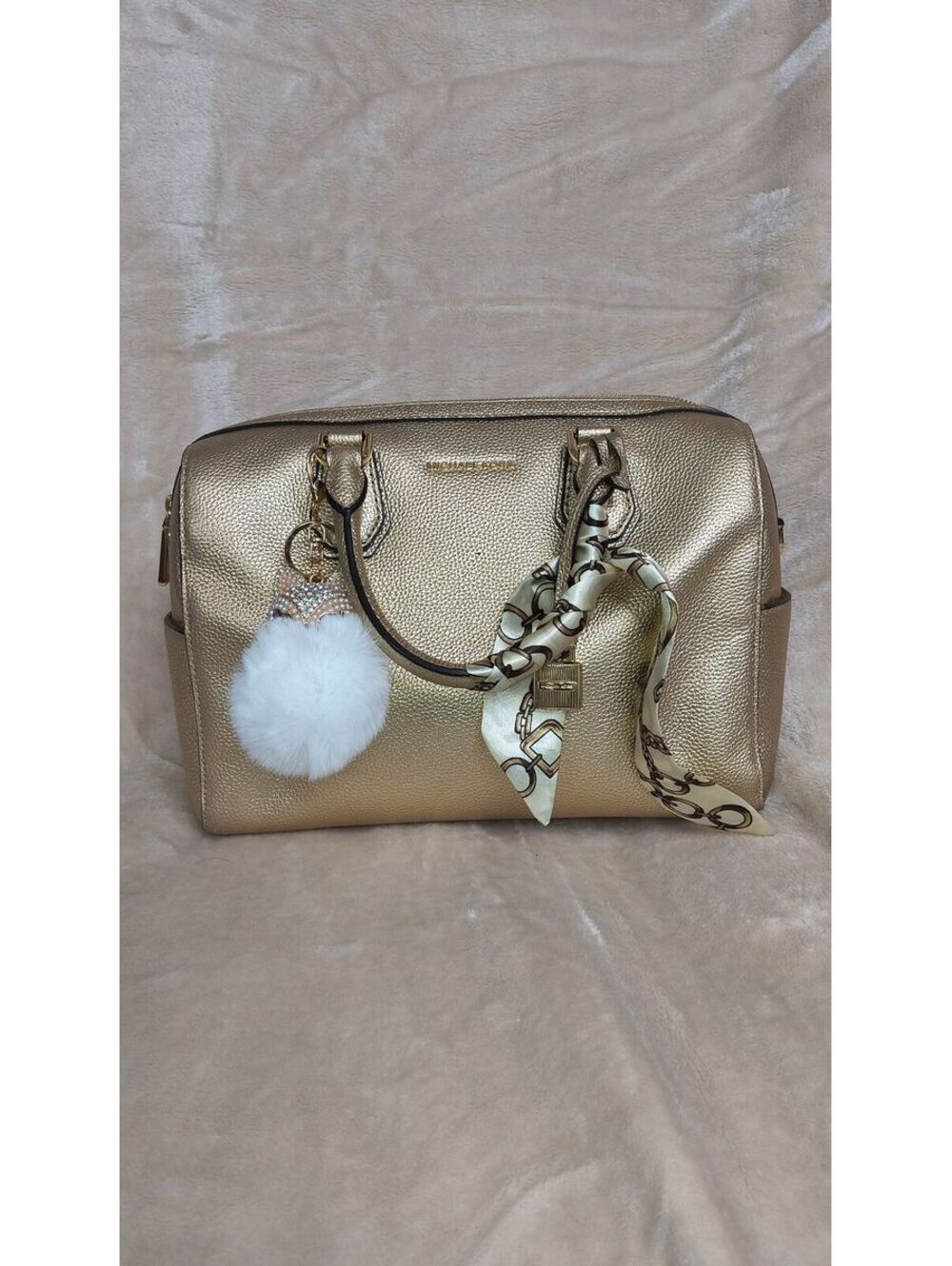 24. Michael Kors Mercer Medium Metallic Leather Duffle